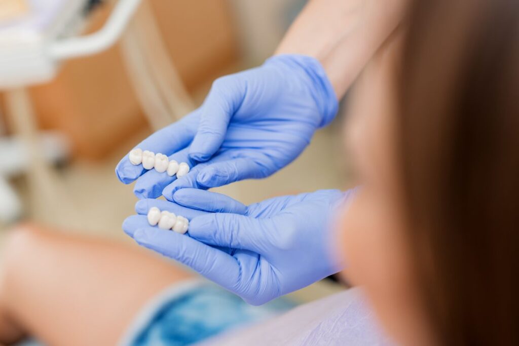 Dental bridge restoration displayed by a dental professional