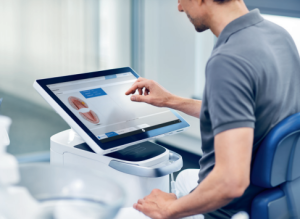 person using a touch screen computer
